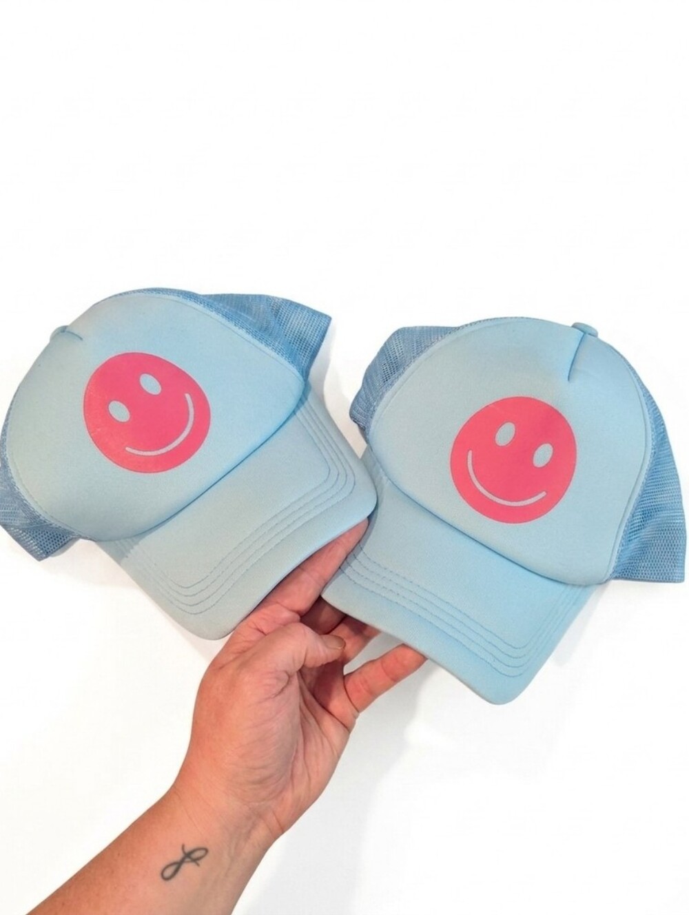 1 for $5 or both for $8 Light Blue Trucker Hat with Pink Smiley Face